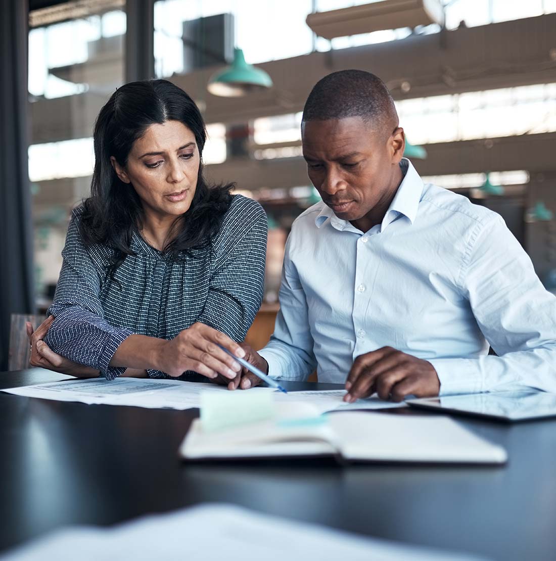 advisor going over documents with a couple